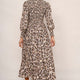 Back view of a model in a snake leopard print midi dress.