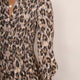 Close-up of the smocked bodice and print detail on the snake leopard Aggie dress.
