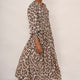 Side profile of a model wearing the snake leopard print Aggie dress.
