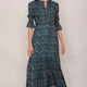 Model wearing the teal confetti Aimee dress in midi length.