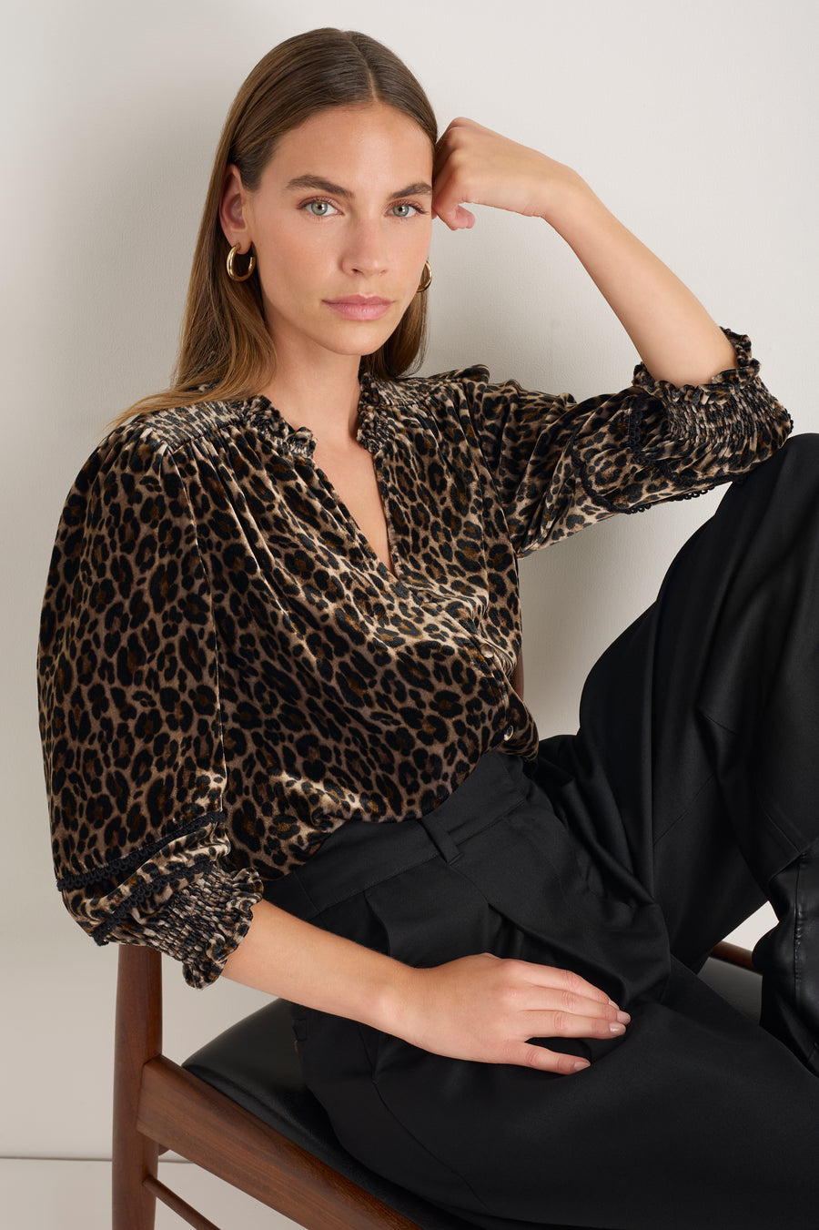 Woman wearing Alina leopard print silk velvet blouse