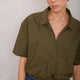 Close-up front view of khaki short-sleeved cotton shirt.